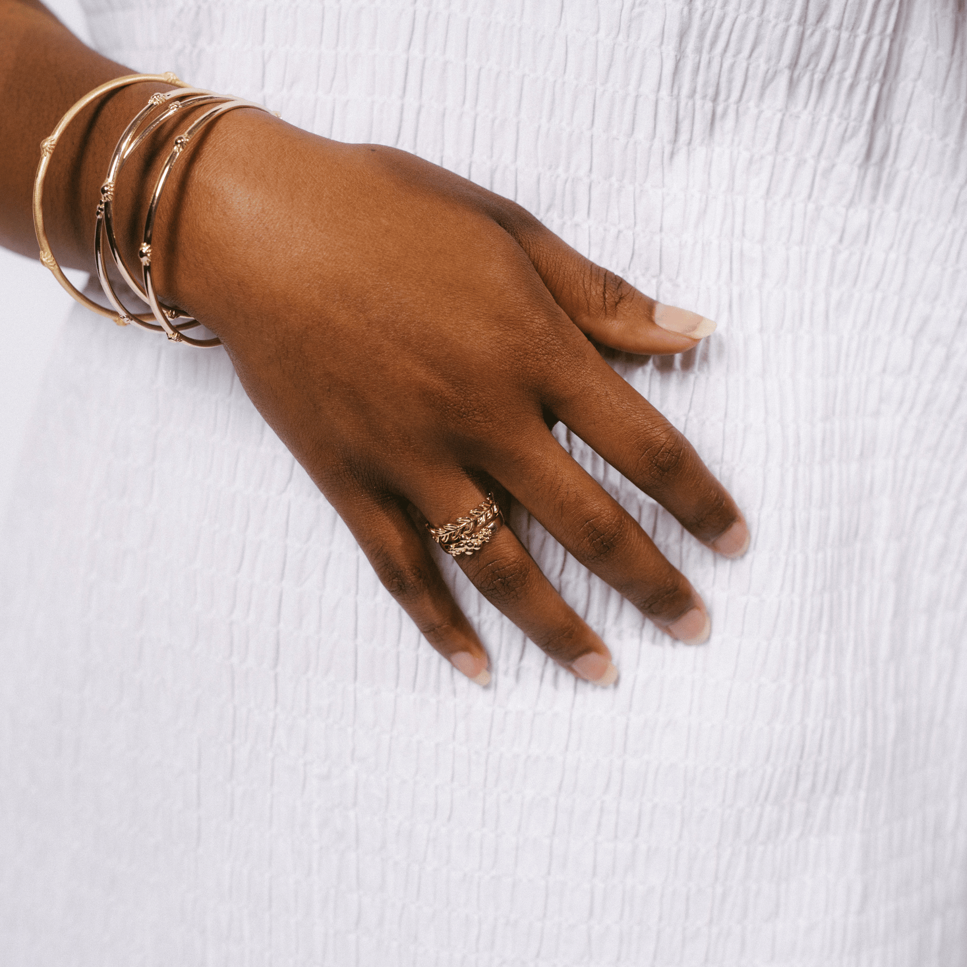 The Frida ring stacked on a woman's hand.