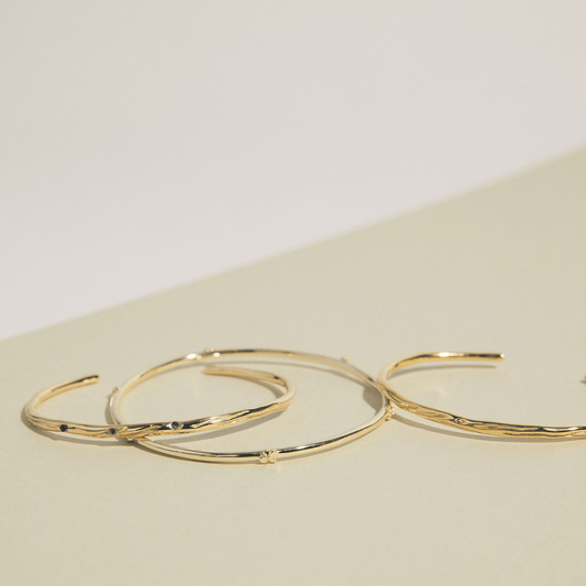 Stack of golden jewelry.